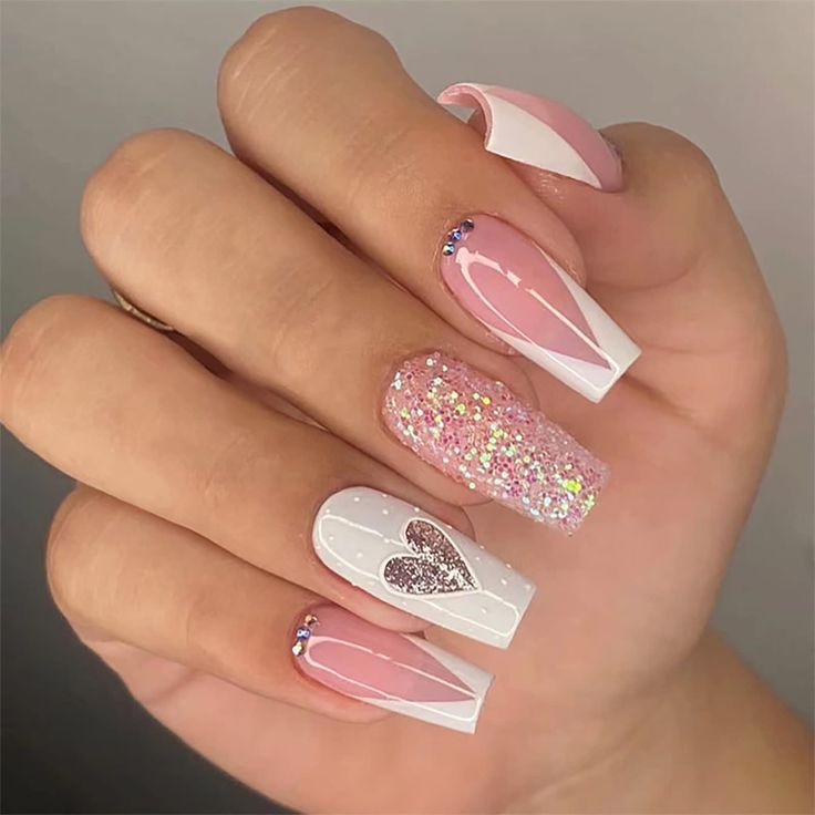 Chic Nail Design: Soft Pink and White with Glitter and Heart Accents for Elegant Playfulness.