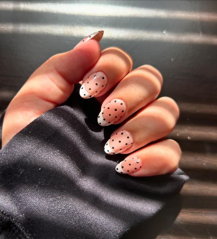 Elegant Polka Dot Nail Design with Nude Base and French Tips.