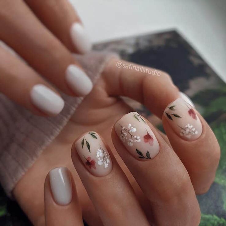 Elegant Floral Nail Design: A Feminine Blend of White and Muted Patterns