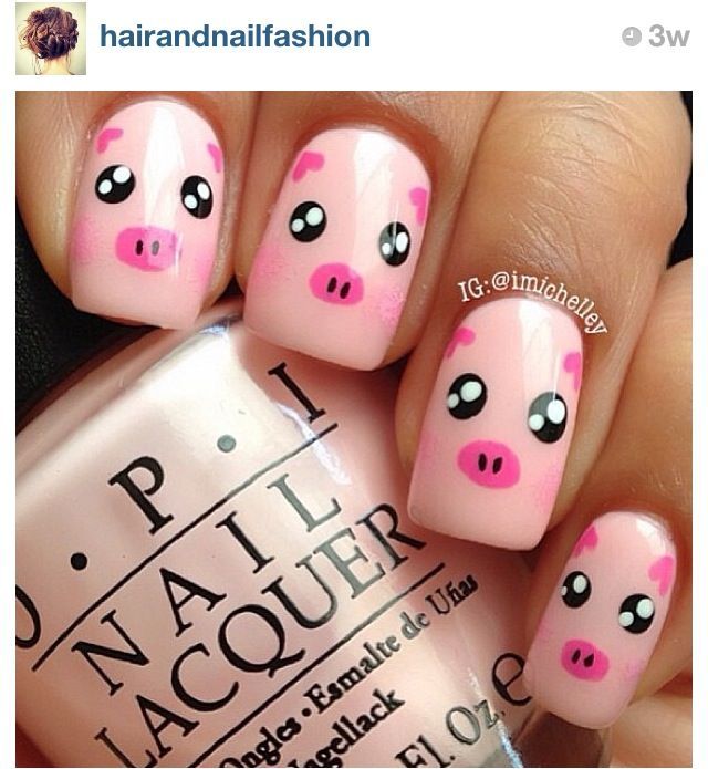 Charming Pig-Themed Nail Design with Whimsical Cartoon Faces and Soft Pink Base.