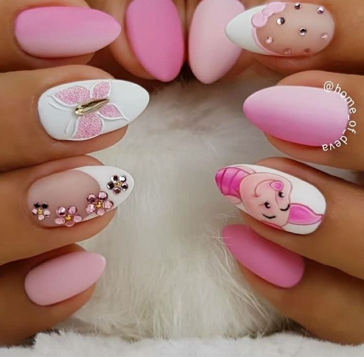 Elegant Pink Nail Design with Floral Artwork and Glamorous Accents.