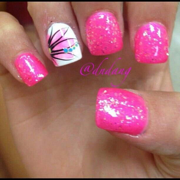 Bold and Playful Vibrant Pink Nail Design with Intricate Floral Accent