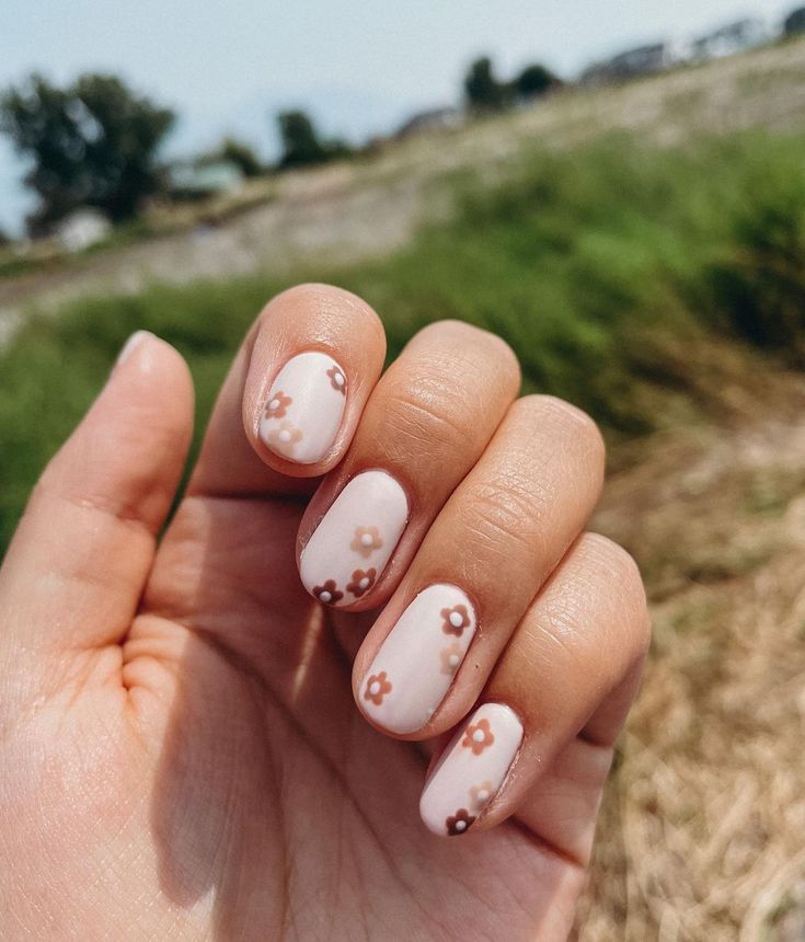 Whimsical Floral Nail Design with Soft Pastels and Delicate Brown Flowers