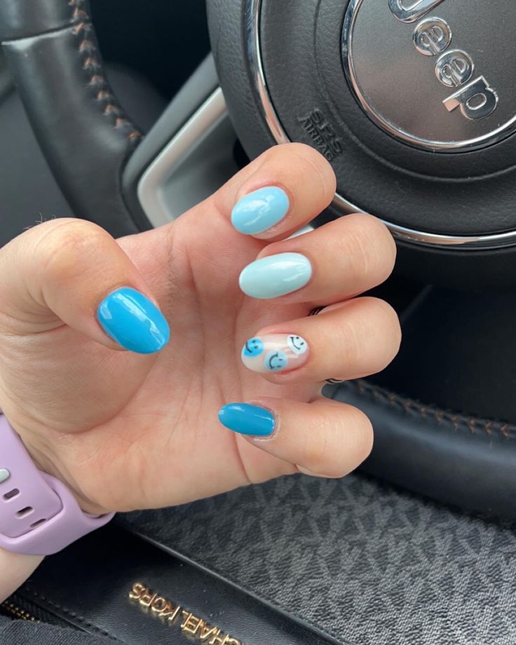 Cheerful Blue Nail Design: A Playful Mix of Solid and Accent Styles