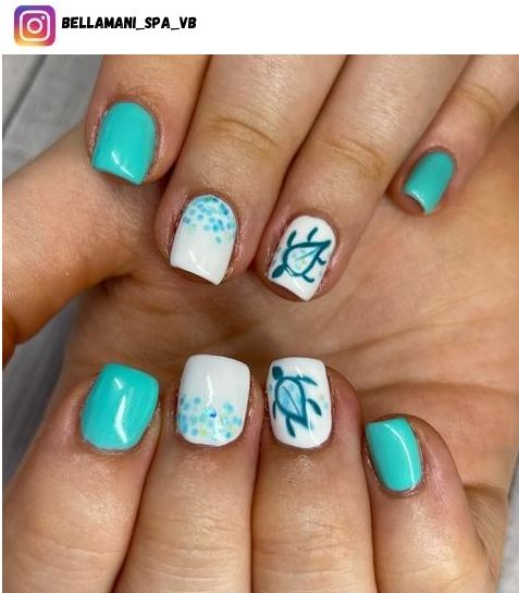 Playful Elegance: Turquoise Nails with Creative Designs and White Accents