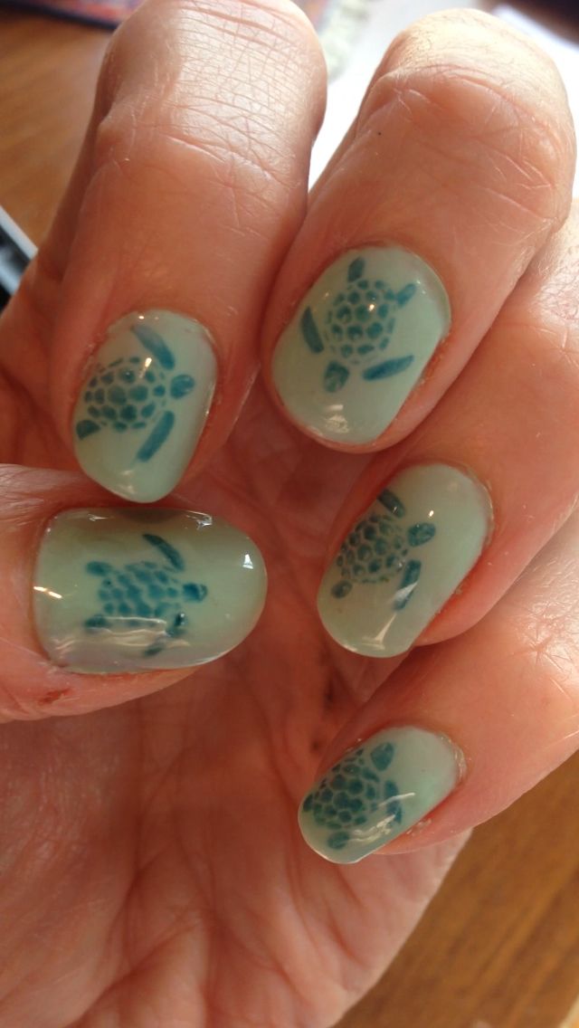 Whimsical Seafoam Green Nail Design with Playful Turtle Motifs for a Beachy Aesthetic