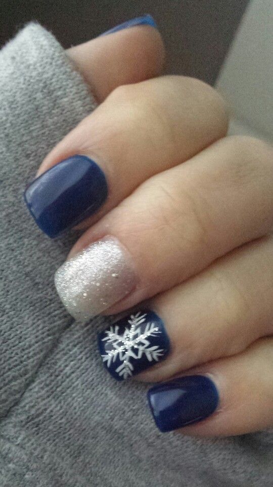 Chic Winter Nail Design: Rich Navy with Sparkling Silver and Snowflake Accents