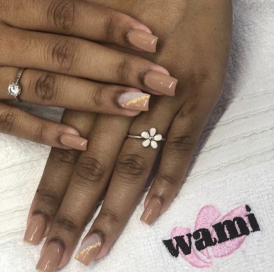 Sophisticated Elegant Nude Nails with Gold Accents and Floral Design