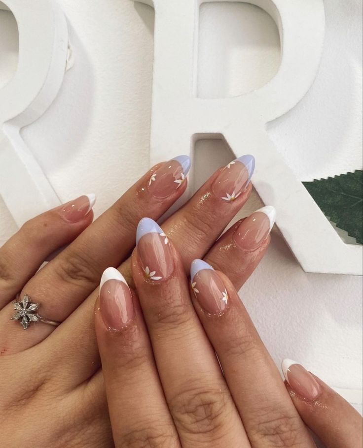 Sophisticated Floral Nail Design with Soft Nude Base and Charming Pastel Accents.