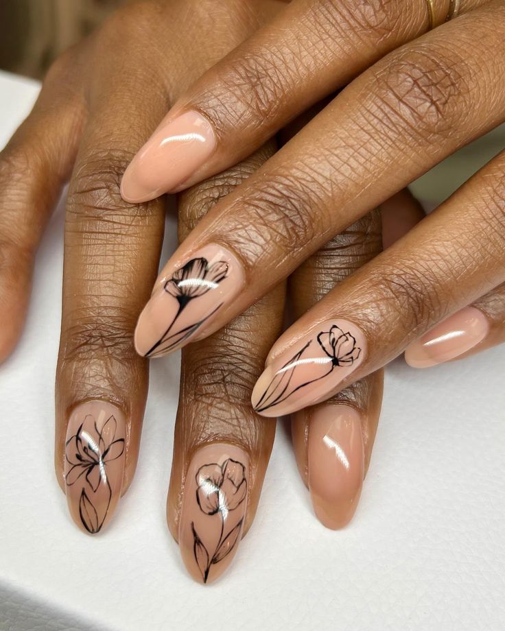 Elegant Floral Nail Art: Chic Contrast of Black Lines on Soft Nude Base.