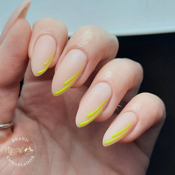 Elegant Almond-Shaped Nude Nails with Vibrant Lime Green Accents for a Fresh Look.