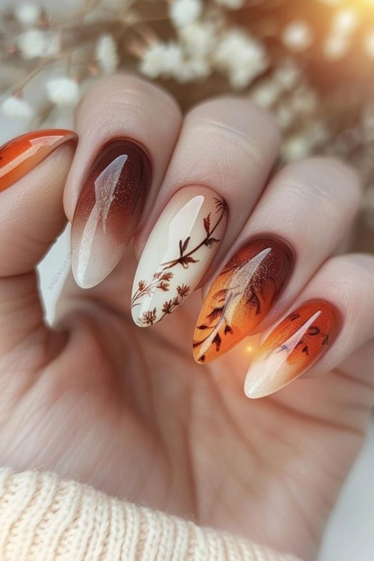 Elegant Autumn-Inspired Nail Design with Warm Gradient, Leaf Motifs, and Glossy-Matte Finishes.