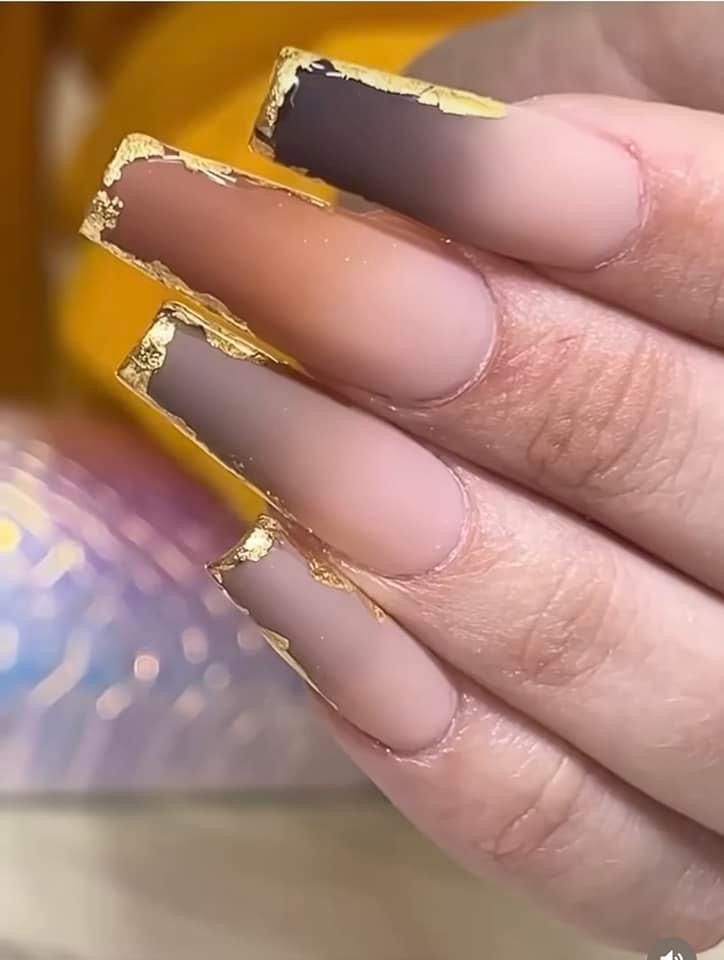 Luxurious Matte Elongated Nails with Gold Foil and Gradient Effect.