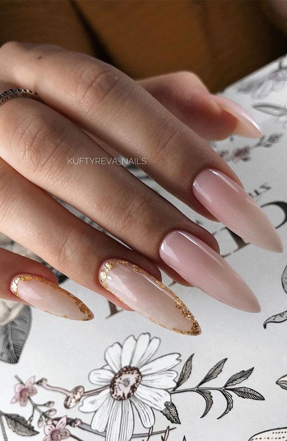 Sophisticated Almond-Shaped Nails with Shimmering Tips and Elegant Gold Accents