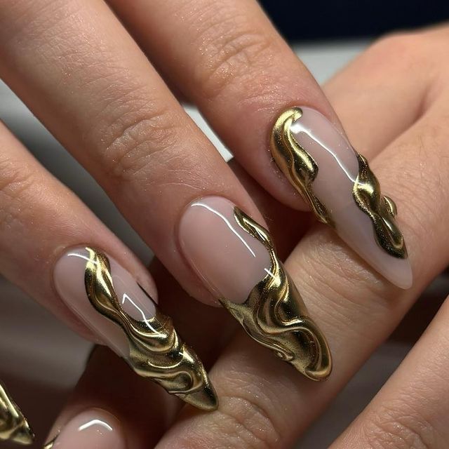 Elegant Gold-Accented Nails with Three-Dimensional Artistry