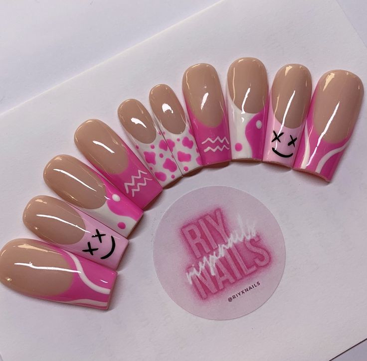 Whimsical Elegance: Creative Nude and Pink Nail Design with Playful Patterns