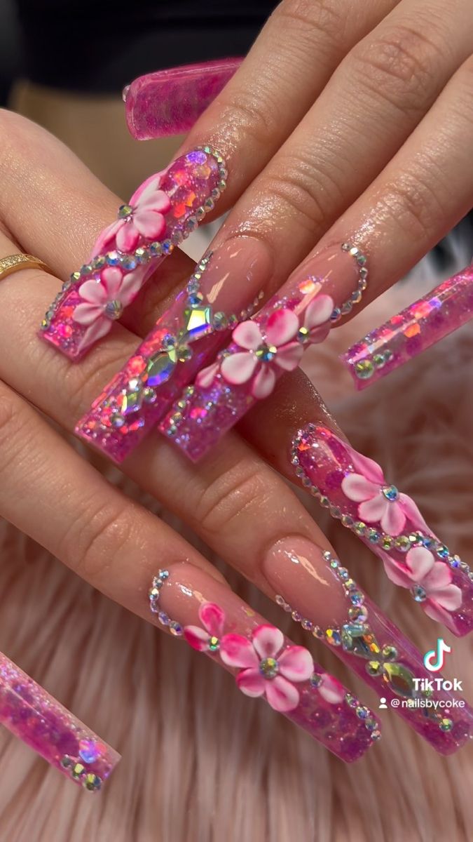 Bold and Whimsical Pink Floral Nail Art with Rhinestones