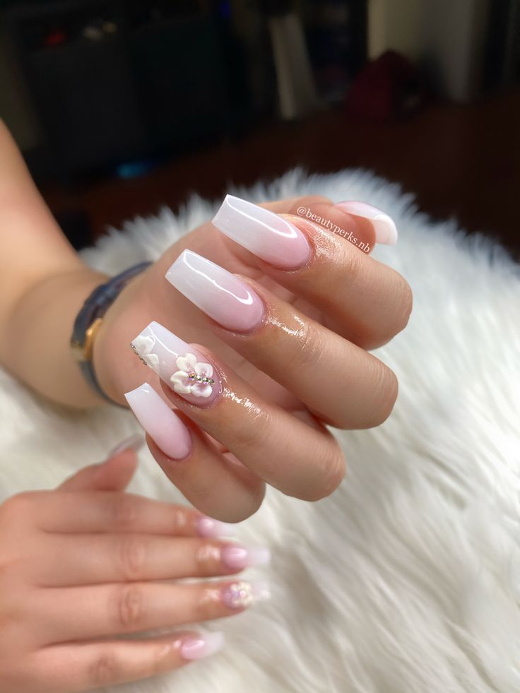 Chic Square Nail Design with White and Soft Pink Hues and Intricate Floral Embellishments.