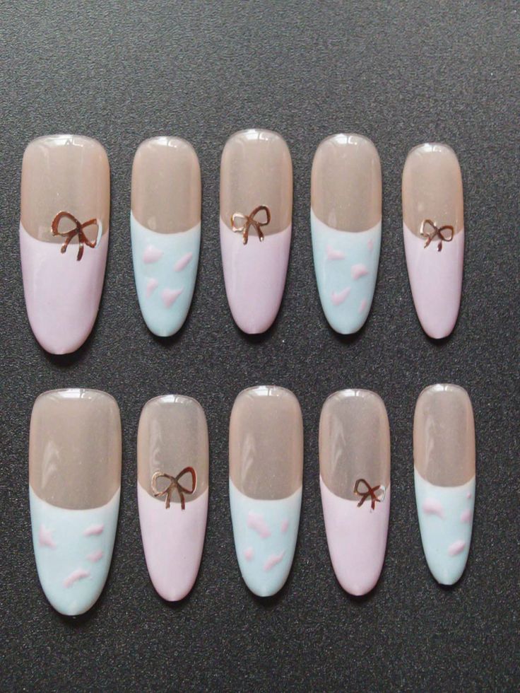 Elegant Pastel Nail Design with Bows and Oval Shaping