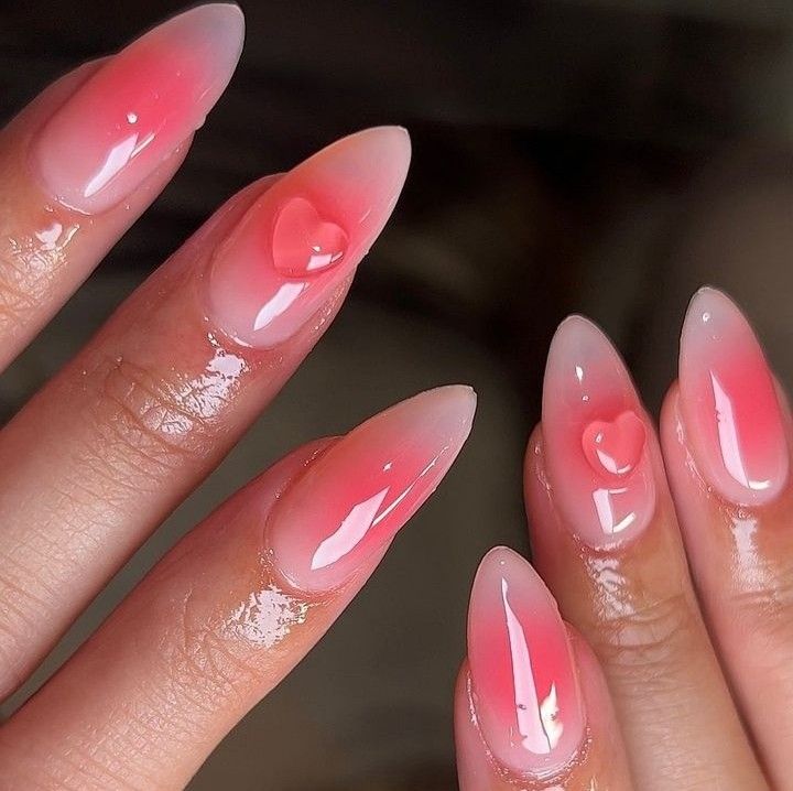 Soft Pink Ombre Nail Design with Heart Shapes and Glossy Finish