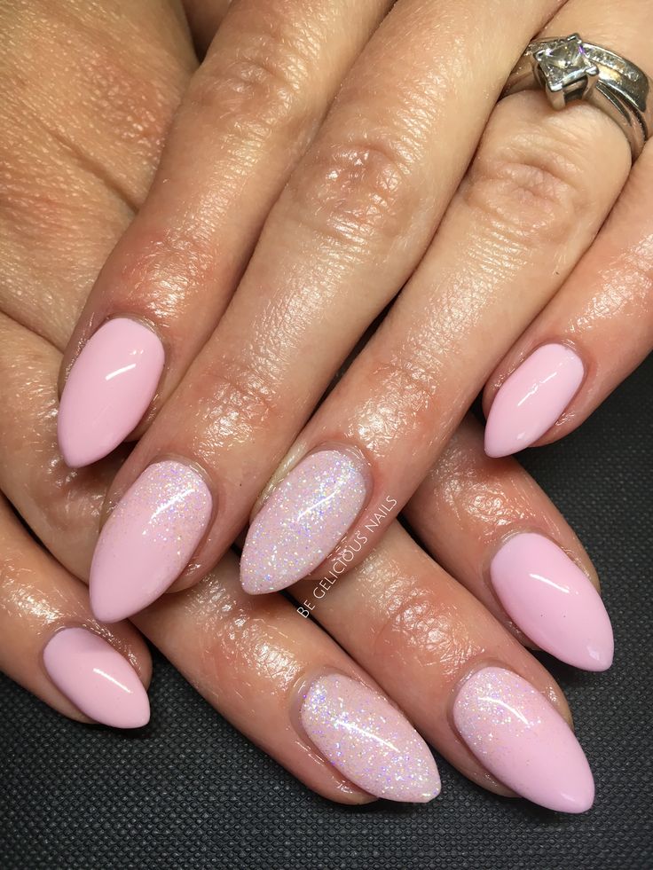 Chic Almond-Shaped Nail Design in Soft Pink with Iridescent Accents