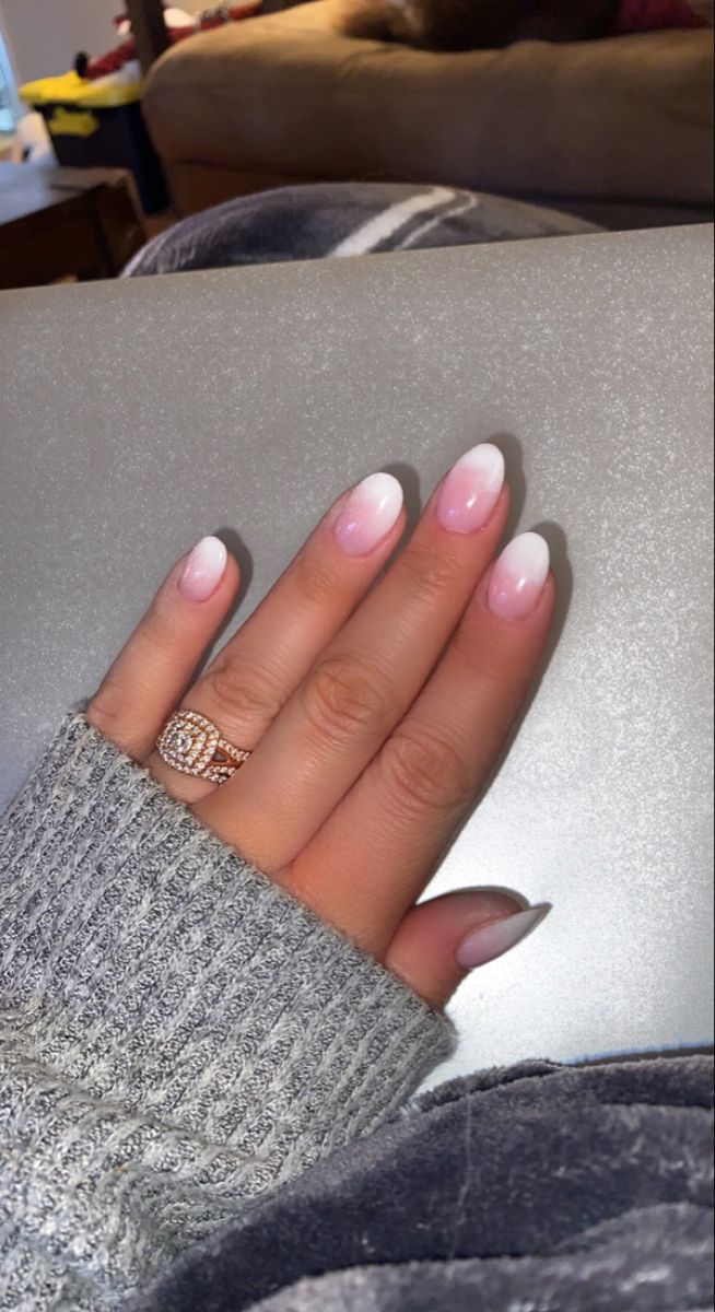 Elegant Ombre French Manicure with Sparkling Accent and Cozy Sweater Aesthetic.