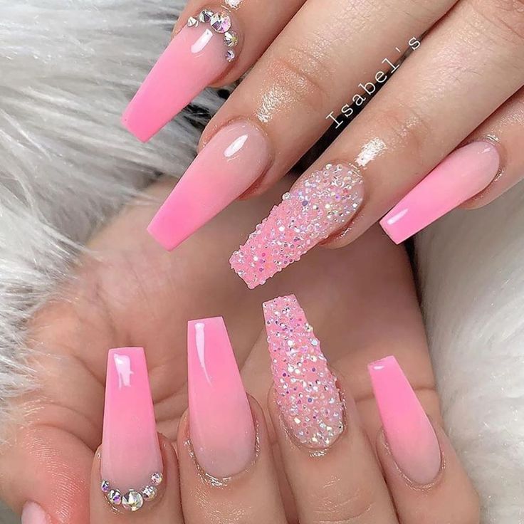 Elegant Pink Nail Design with Ombre, Glitter, and Rhinestone Accents.