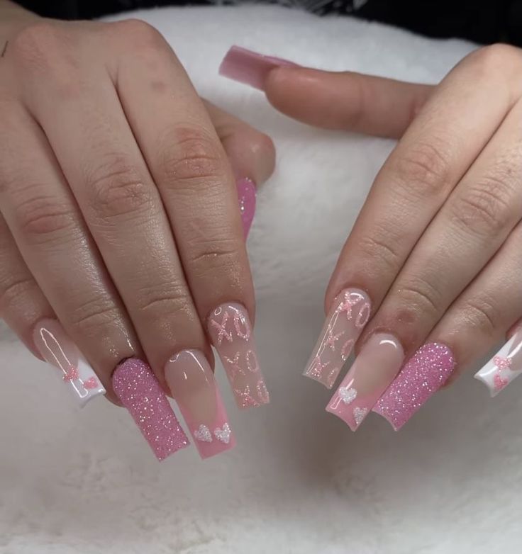 Charming Pink Nail Design with Glossy, Glittery Finishes and Intricate Details.