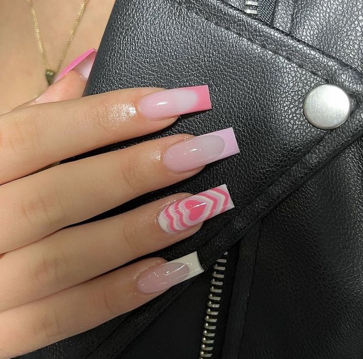 Chic Pink Ombre Nail Design with Solid Accents and Swirl Patterns for a Bold, Elegant Look.