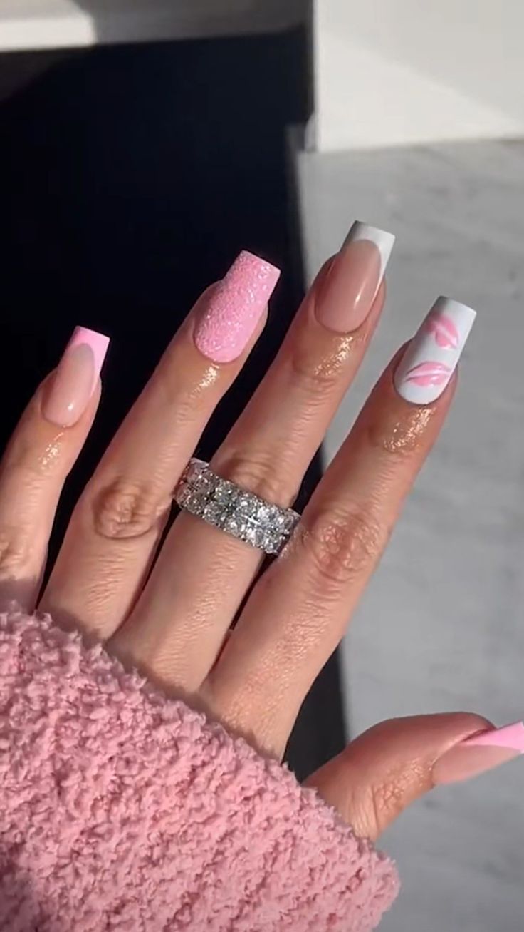 Chic Multi-Textured Nail Design with Pink, Nude, and Abstract Accents.