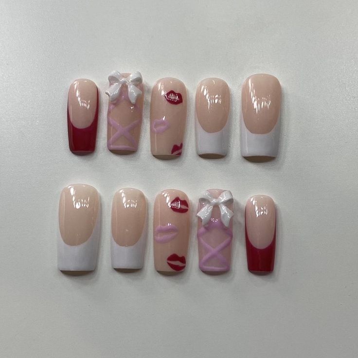 Chic Nail Design Blending Soft Nude with Vibrant Red Accents and Romantic Details.