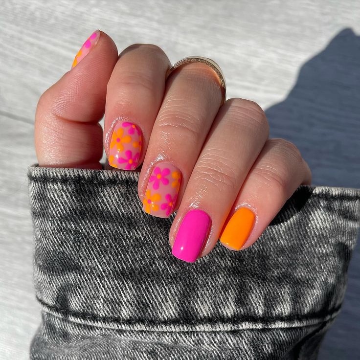 Vibrant Summer-Inspired Nail Design with Playful Floral Patterns