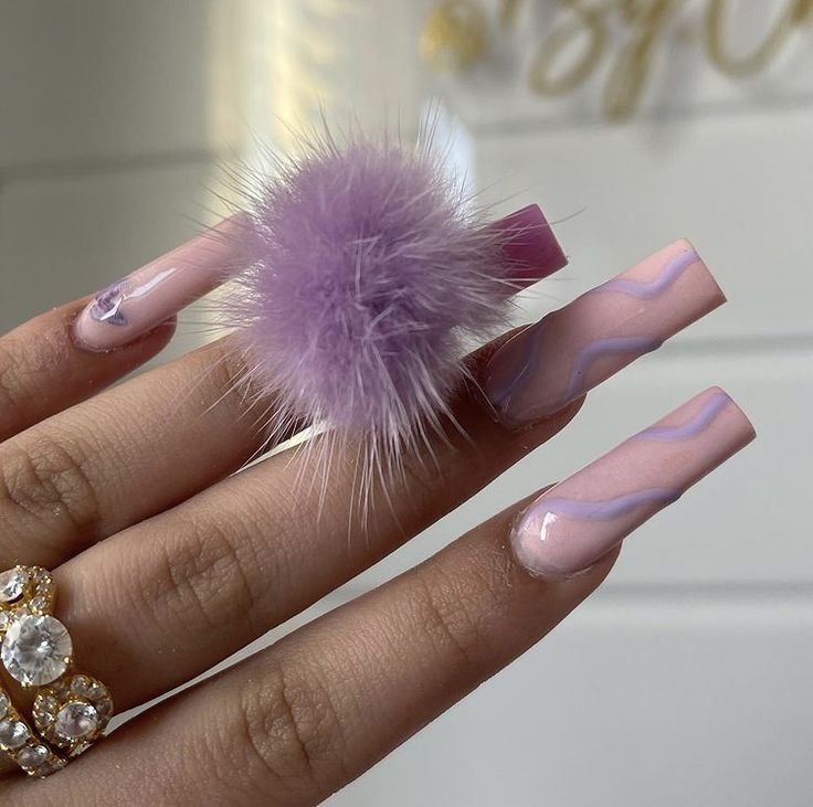 Elegant Long Nails with Soft Pink Tones & Whimsical Lilac Pom-Pom.