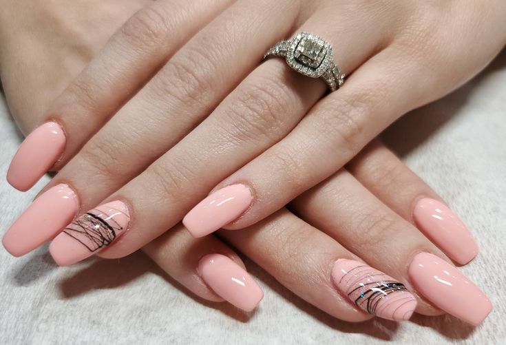 Sophisticated Soft Pink Nail Design with Marble Accents and Elegant Rings.