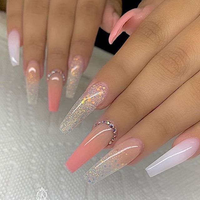 Elegant Gradient Nail Design with Soft Pink, Clear Glitter, and Rhinestone Accents.