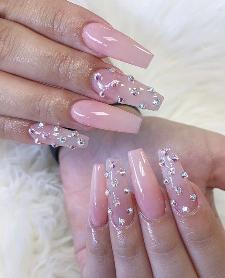 Glamorous Long Square Nail Design with Soft Pink Base and Rhinestone Accents.