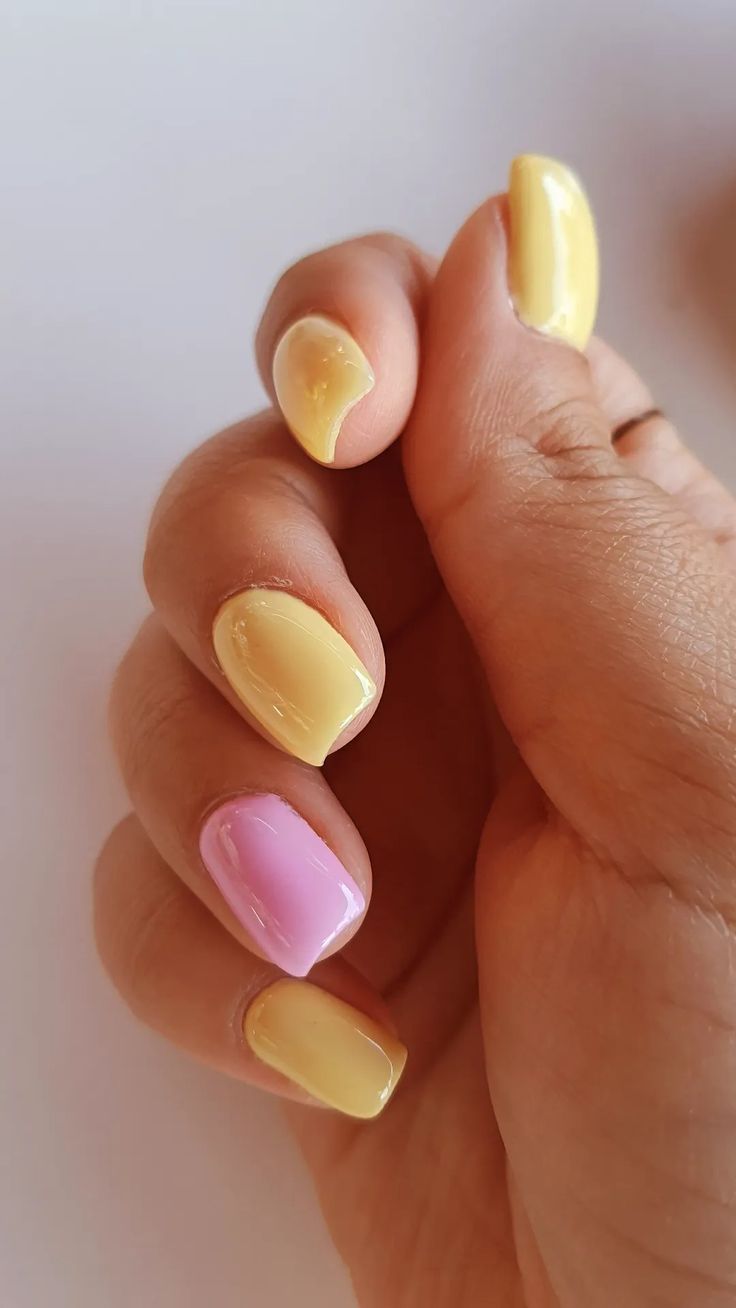 Vibrant Pastel Nail Design: Cheerful Yellow and Playful Pink with Glossy Finish