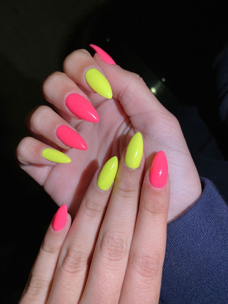 Bold Neon Pink and Yellow Pointed Nail Design for a Striking Statement Look.