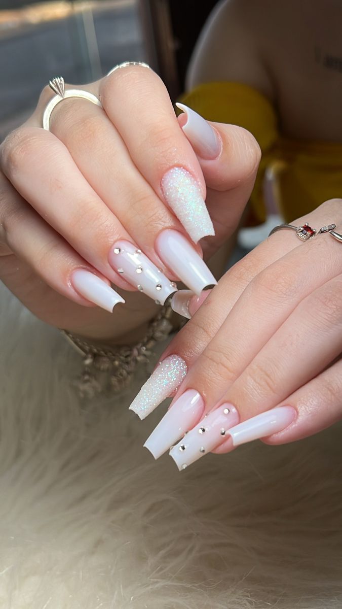 Chic Almond-Shaped Pastel Nail Design with Glitter and Rhinestones