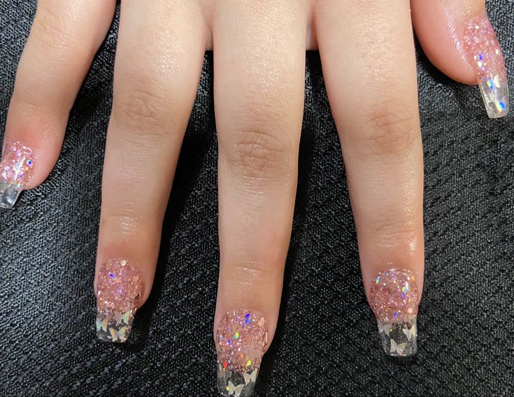 Chic Pink and Silver Glitter Nail Design with Elegant French Tips