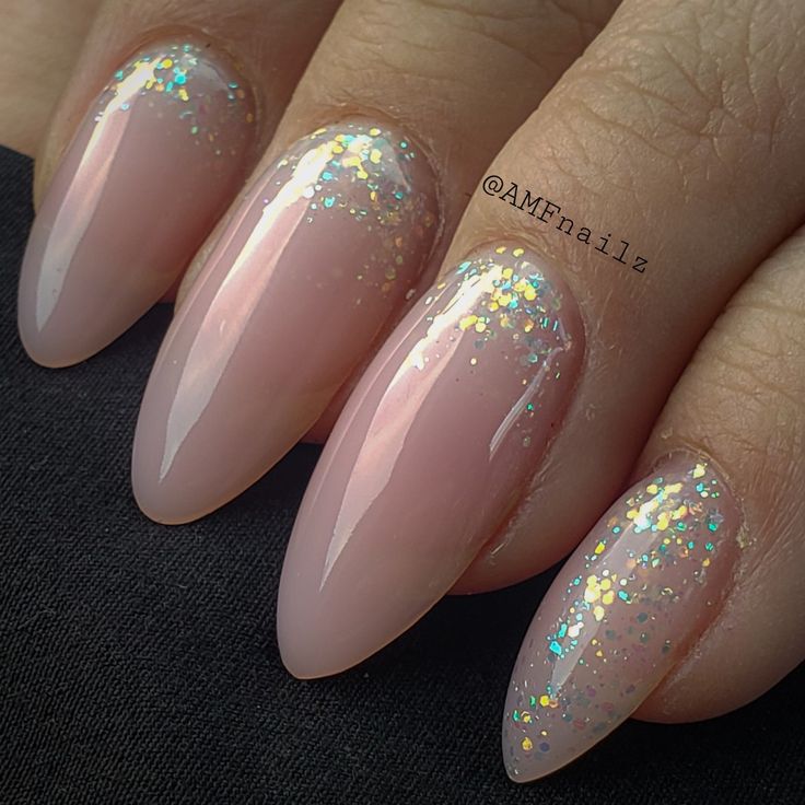 Sophisticated Almond-Shaped Nails with Subtle Ombre and Glitter Accents