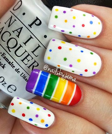 Playful Summer Nail Design with Colorful Polka Dots and Bold Rainbow Stripe