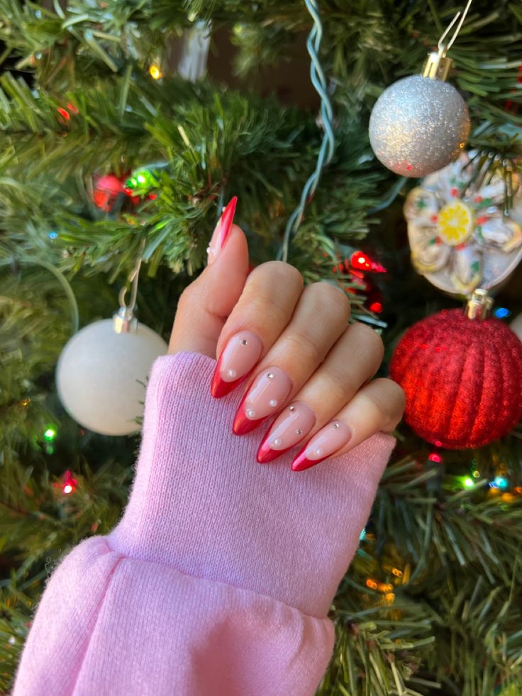 Holiday-Inspired Nail Design: Elegant Pink and Red Tips with Playful White Dots