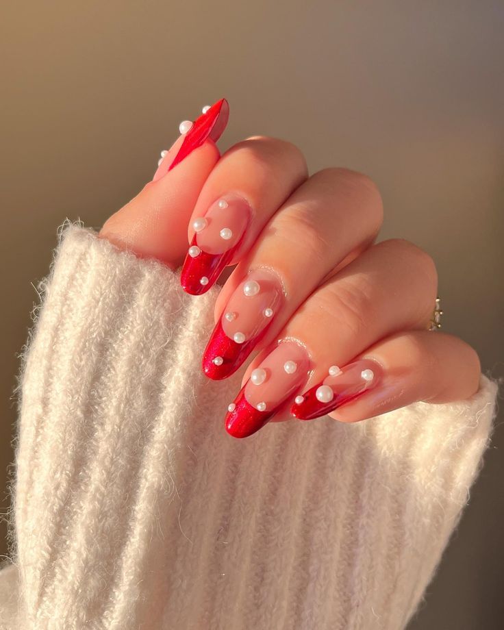 Chic Red Ombre Nails with Pearls: A Playful Twist for Elegant Occasions.