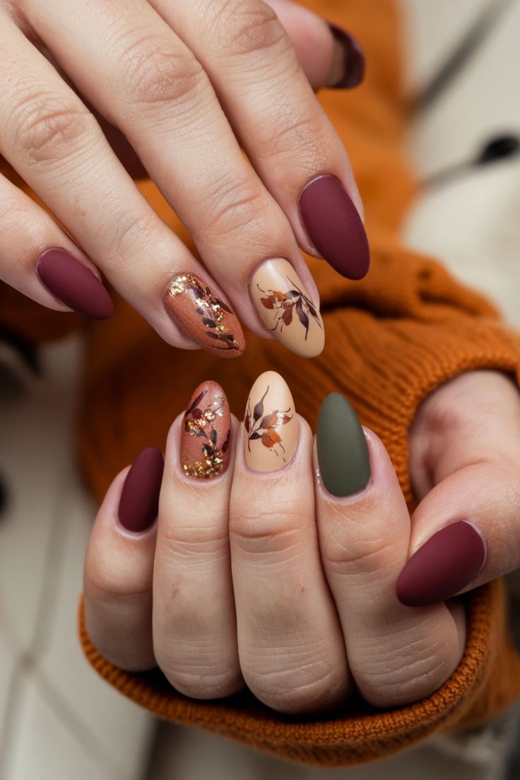 Autumn-Inspired Nail Design: Rich Colors, Floral Patterns, and Dynamic Finishes.