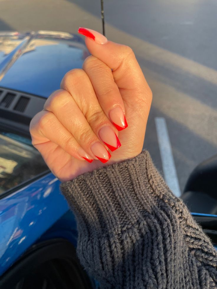 Chic Modern Twist on Classic French Manicure with Bold Red Tips.