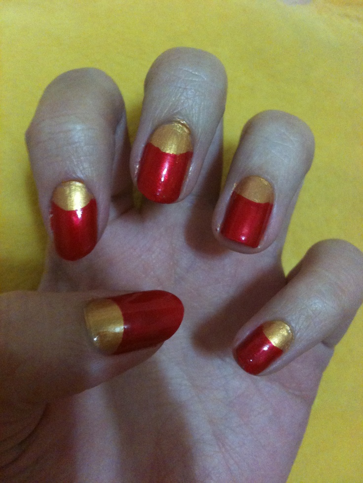 Chic Red and Gold Half-Moon Nail Design for Any Occasion.