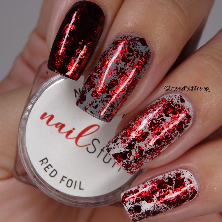 Glamorous Deep Red Nail Design with Striking Silver Foil Accents.