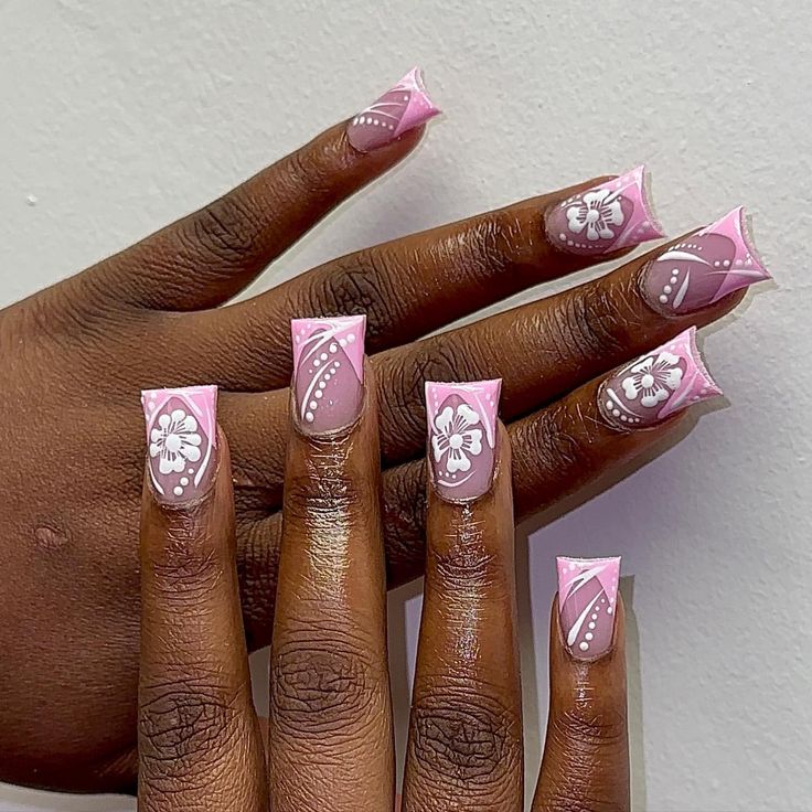 Elegant Pink and White Nail Design with Intricate Floral Patterns and Sharp Square Shape.