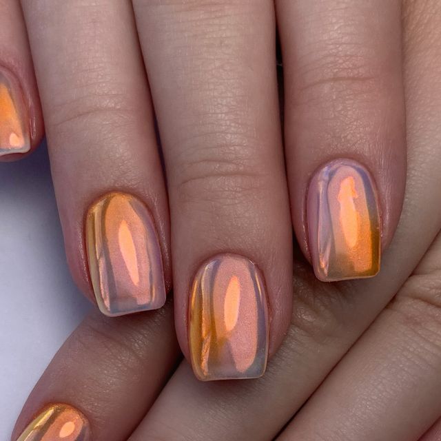 Iridescent Orange-Peach Nail Design for a Captivating Sunset Elegance.